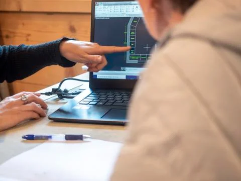 Architect presents planimetric project to the client Stock Photos