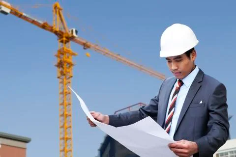 Architect reading a drawing Stock Photos