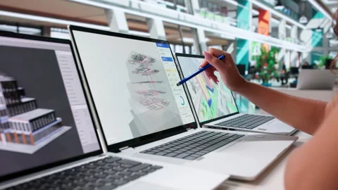 Architect Reviews 3D Building Model On Laptop Stock Footage 346344681