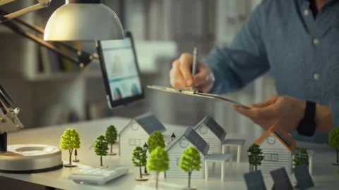 The architect reviews projects and maintains a log of performance data. Mode Stock Footage 323928069