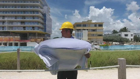 Architect rewiewing plans Stock Footage 70610616