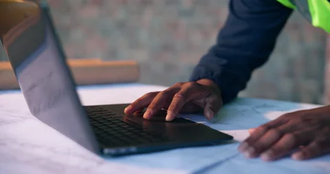 Architect, scroll and hands with laptop on construction site, info and plan for Stock Footage 337017165