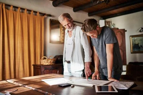 Architect, senior man and apprentice with documents together for learning Stock Photos