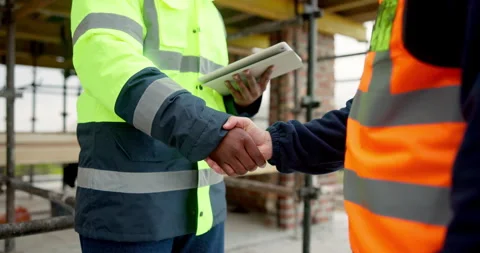 Architect, shaking hands and team with tablet on construction site, talk and Stock Footage 337628468