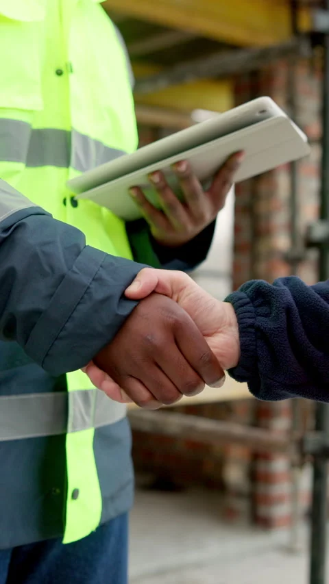 Architect, shaking hands and team with tablet on construction site or property Stock Footage 338010422