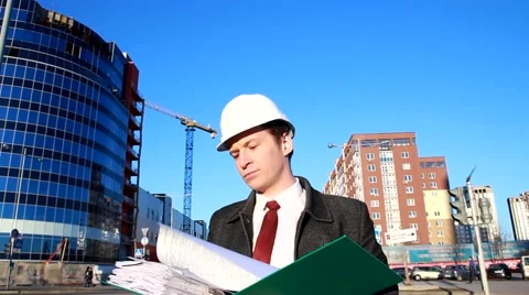 Architect on the site reads the documents Stock Footage 48076197