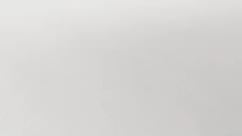 Architect sits at the table, chooses a drawing that is more optimal for him Vidéo 73674828