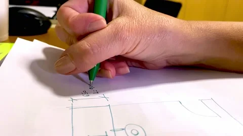 Architect sketching a concept design at her work desk Stock Footage 200183192