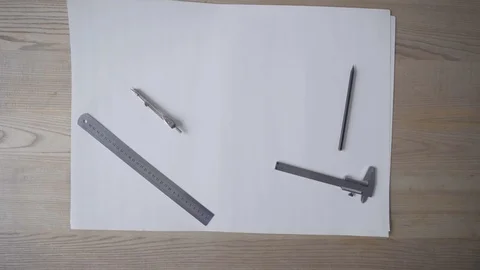 The architect, a student, begins to work drawings, picks up a ruler and a pencil Video stock 107070653