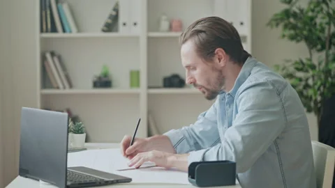 Architect student watching tutorial and drawing construction design at home Video stock 169931513