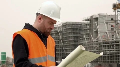 Architect studies the project in construction site Stock-Footage 72302954
