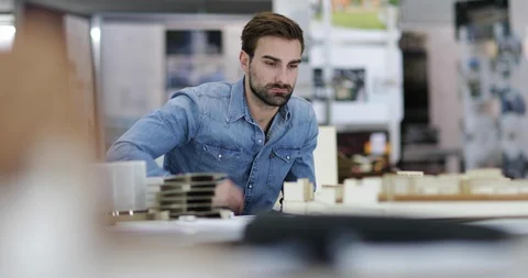 Architect studying model Stock Footage 86805814