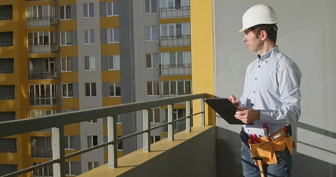 Architect supervises building of compex and writes notes Video stock 228555925