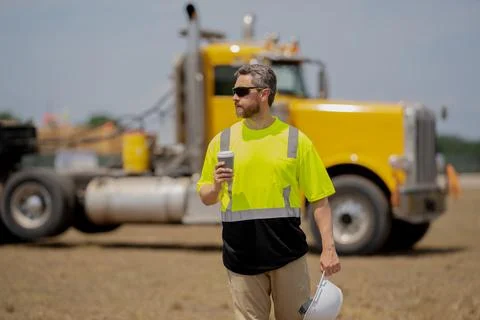Architect supervisor or construction engineer man with truck on background of Stock Photos