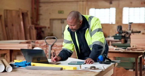 Architect, tablet or black man with blueprint in workshop for building or Stock Footage 338036376
