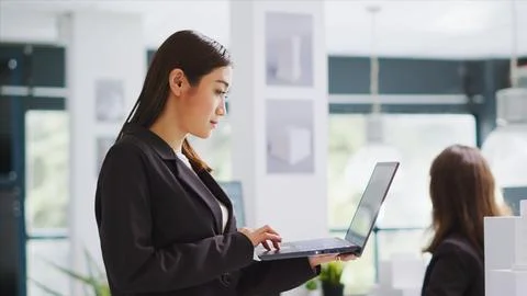 Architect takes notes on laptop for development plan Stock Photos