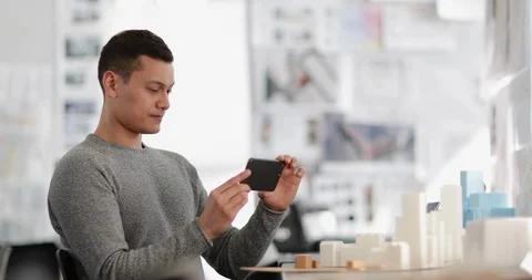 Architect taking photo of model in studio Stock Footage 86797964