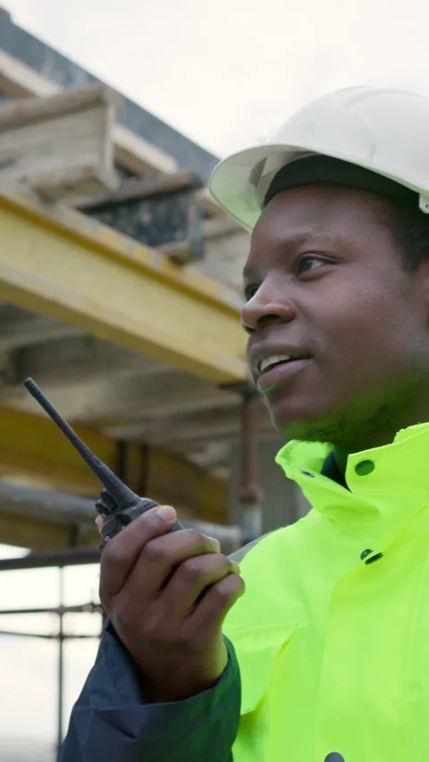 Architect, talking and man with radio on construction site, project management Stock Footage 337991842