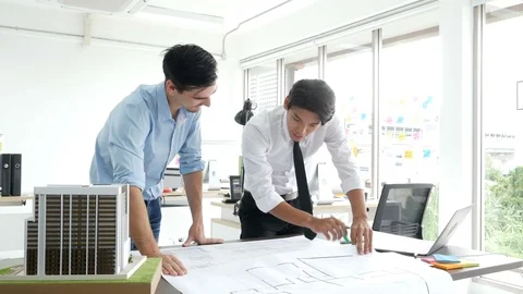 Architect talking to building project together. Stock Footage 91274906