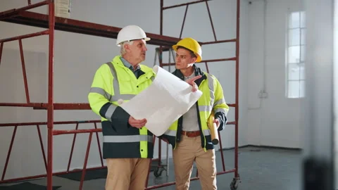 Architect, team and construction with blueprint in building for safety, security Stock Footage 341566792