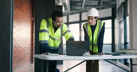 Architect, team and discussion in building with laptop, review design and Stock Footage 340627654