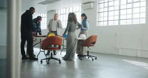 Architect, team and discussion in office for project scope, construction cost or Stock Footage 341378518
