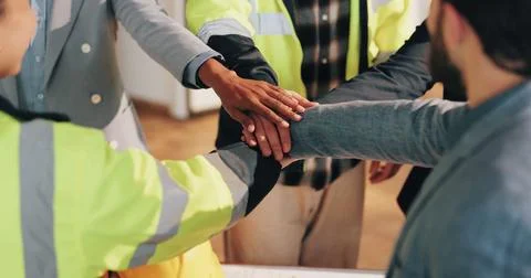 Architect, team and hand stack on construction site, partnership and unity for Photos