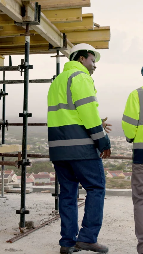 Architect, team and men with tablet on construction site, talk and planning for Stock Footage 338037853