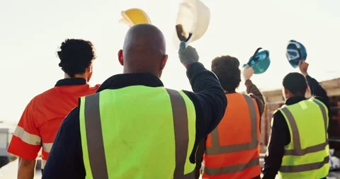 Architect, team and raised hand with hardhat for construction, safety and ppe Stock Footage 336793032