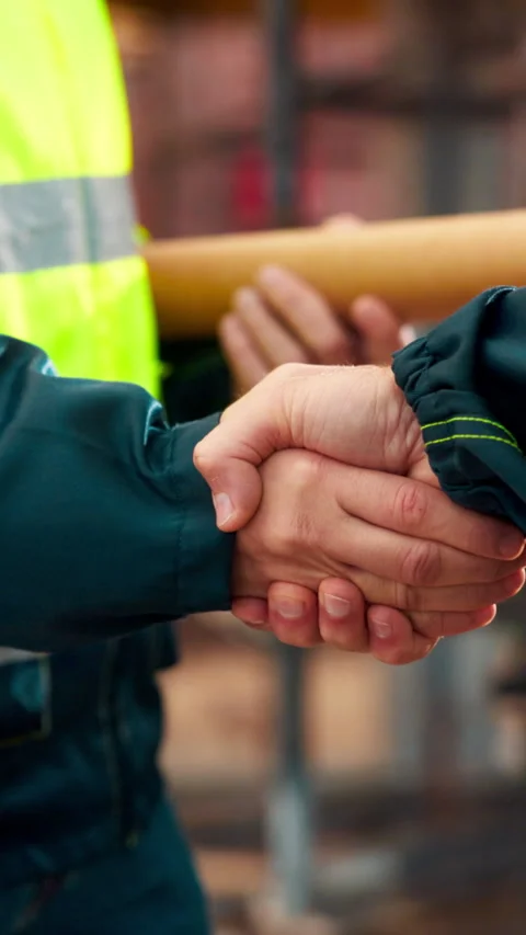 Architect, team and shake hands for construction collaboration for renovation or Stock Footage 336205123
