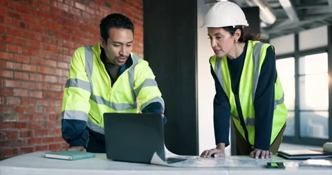 Architect, team and talk in office with laptop, review property design and Stock Footage 340609262