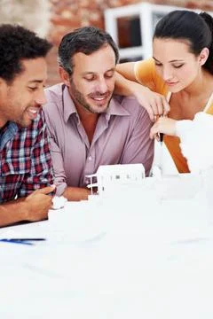Architect, team and talking with 3D model in office, brainstorming and real esta Stock Photos