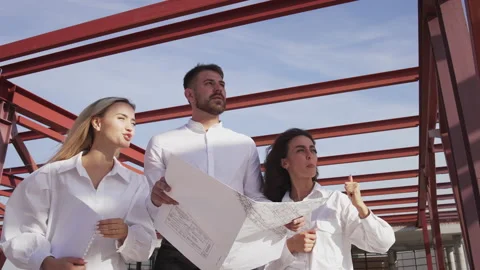 Architect team together developing building estate plan on construction facility Stock Footage 222128517