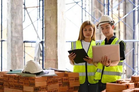 Architect team using modern devices and discussing, planning development details Stock Photos