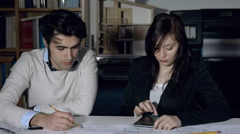 Architect team at work: businesspeople at work on blueprints 스톡 동영상 49773528