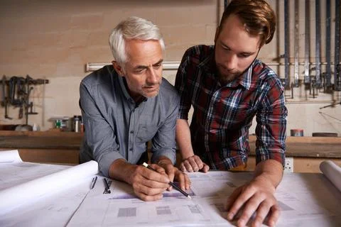 Architect team, working on blueprint in workshop and designer for engineering Stock Photos