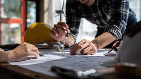 Architect team working with blueprints for architectural plan, engineer Foto stock