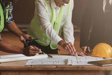 Architect team working with blueprints for architectural plan, engineer Stock Photos