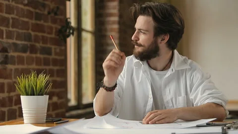 Architect Thinks as Designing Building Stock Footage 92695440