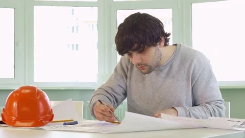 Architect uses compass at his work Stock-Footage 73912076