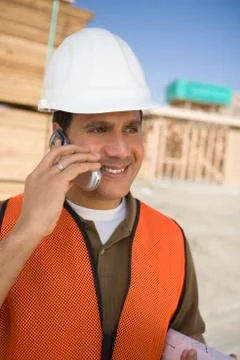 Architect Using Cell Phone At Site Stock Photos