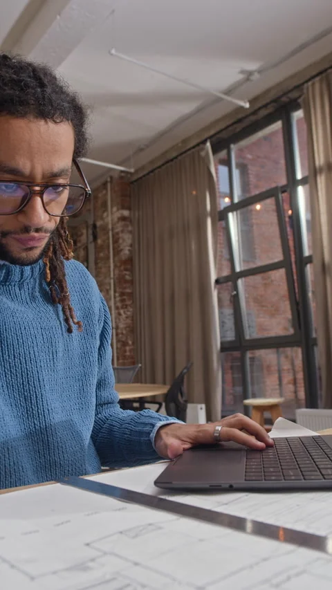 Architect Using Laptop while Developing Building Plan at Workplace Stock Footage 327851417