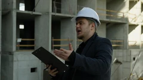 Architect using a stylus on a tablet computer on a construction site Stock Photos