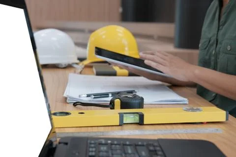 Architect using tablet. engineer working on house blueprint of real estate pr Foto stock
