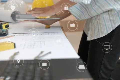 Architect using tablet. engineer working on house blueprint of real estate pr Foto stock