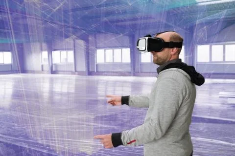 Architect with VR visor exploring industrial building environment Stock Photos