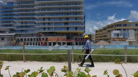 Architect walking past his project Stock Footage 70534374