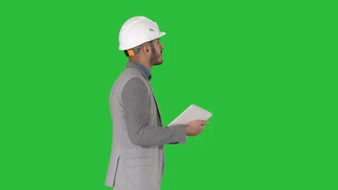 Architect walking with tablet and checking what is built on a Green Screen Vídeo Stock 108241954