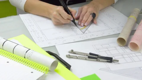 Architect at work drawing plans. Stock Footage 70819213