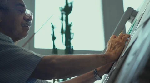 Architect working. Architect sitting in front of the easel Video stock 68139401